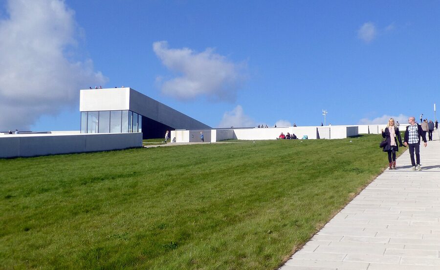 People walking up the grass roof of the Moesgaard Museum, Aarhus