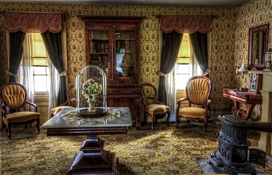 A Victorian-era living room interior with old furniture and lamps, the kind of objects sold in Porvoo antique shops