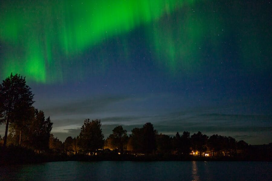 Northern lights over rural landscape in Kiruna