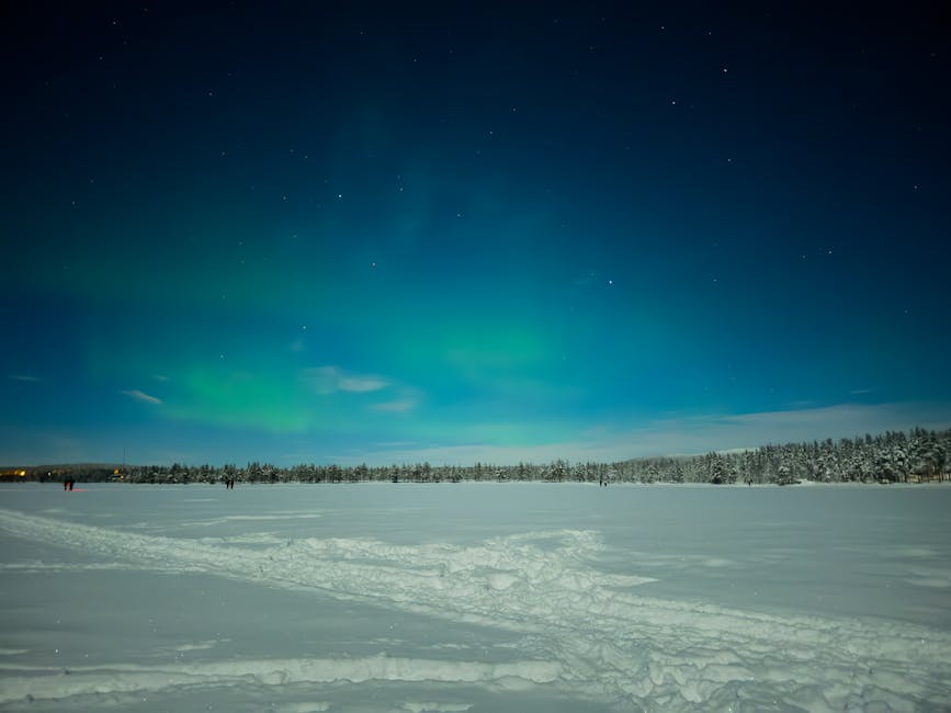 Aurora borealis on a snowy plain in Kittila