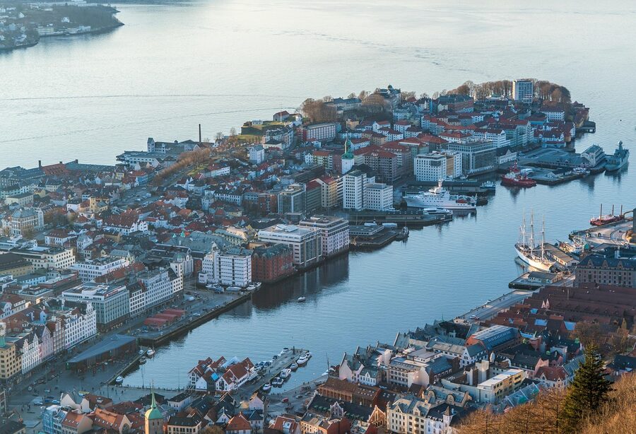 High-angle view across Bergen central harbour with Bryggen hotels visible