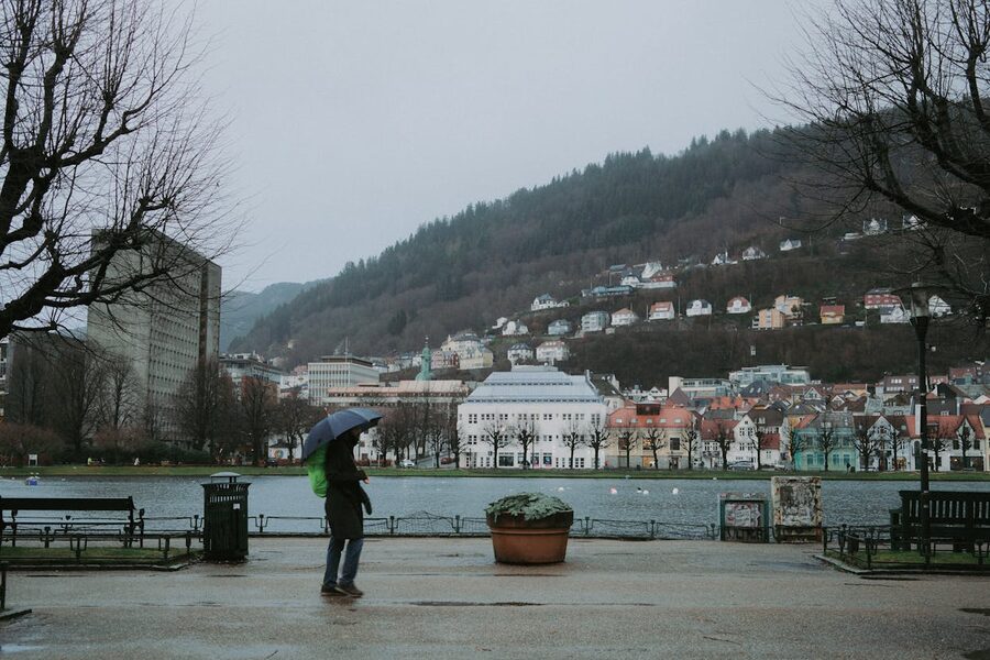 A pedestrian carries an umbrella through Bergen on a rainy day