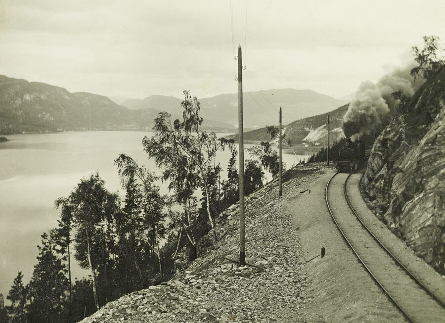 Bergen Line train running beside Lake Krøderen in eastern Norway