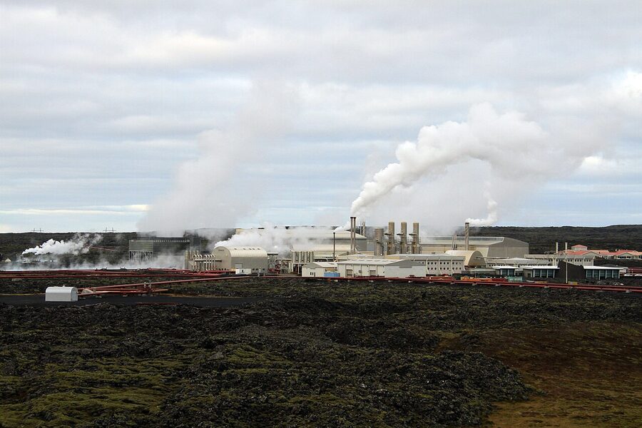 Bathers at the Blue Lagoon by the lava bank