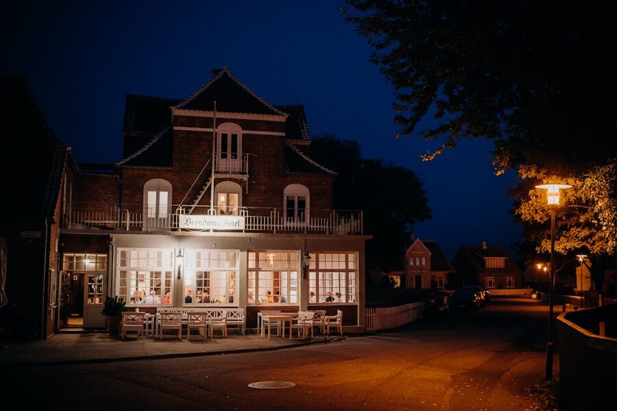 Brøndums Hotel in Skagen with evening lighting and outdoor seating