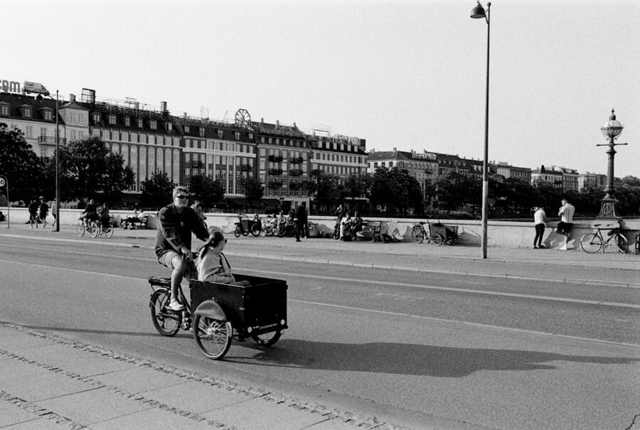 Cyclist on a Copenhagen street in black and white