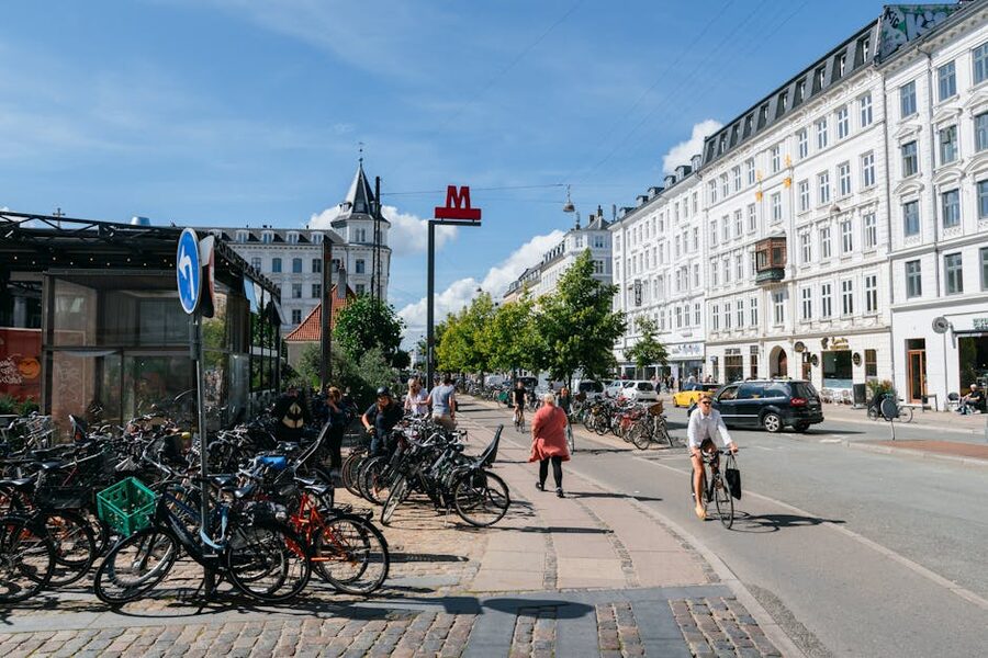 Cyclists and pedestrians sharing a Copenhagen street on a clear day