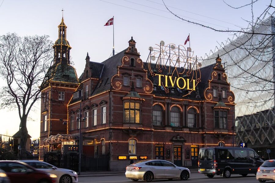 Tivoli Gardens entrance illuminated at twilight in Copenhagen