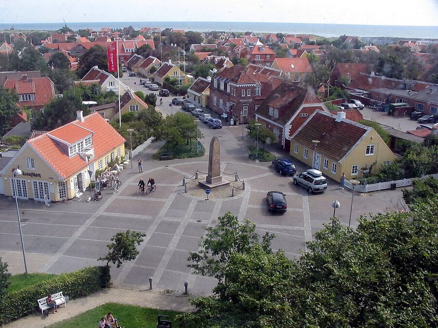Yellow houses on Daphnesvej in Skagen with white-trimmed red tile roofs