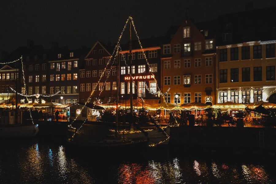 Copenhagen harbour illuminated at night with festive lights