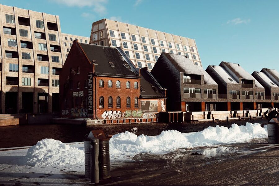 Nyhavn canal in Copenhagen with snow on the historic harbour buildings