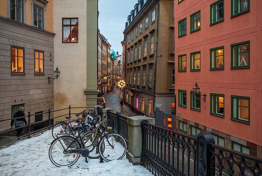 Cobbled corner of Gamla Stan, Stockholm in December with traditional yellow buildings