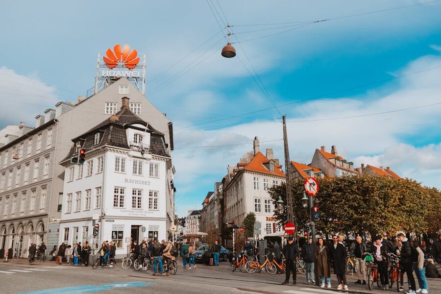 Strøget Copenhagen with people walking past historic buildings
