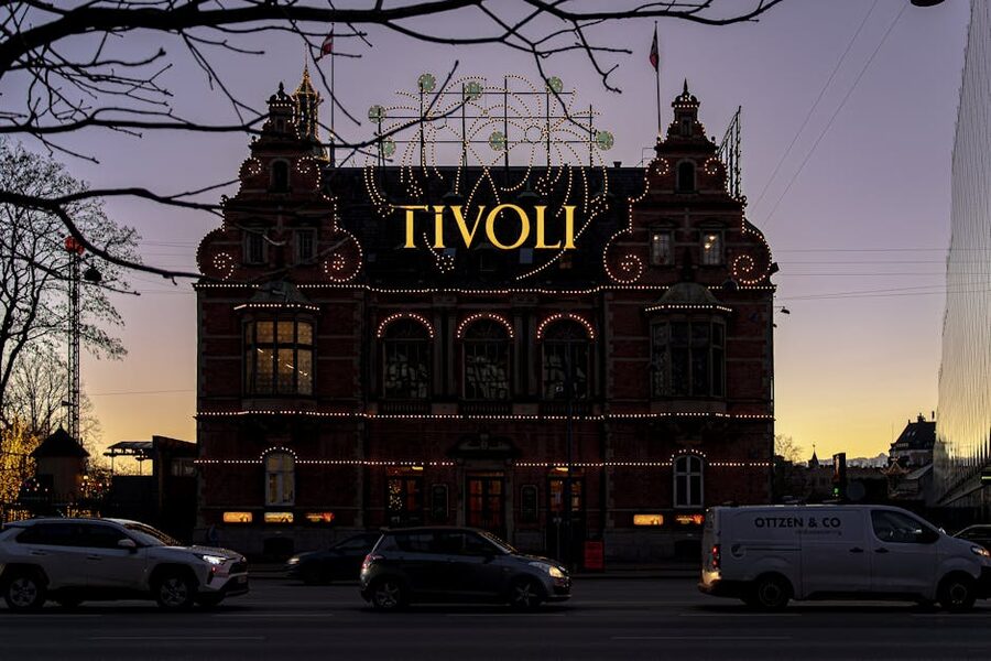 Tivoli Gardens entrance illuminated at twilight in Copenhagen