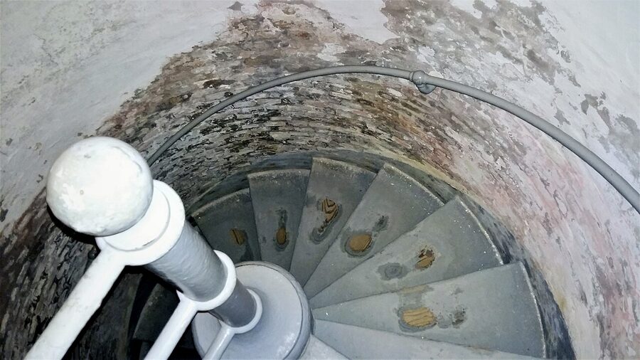 Inside the Grey Lighthouse, climbing the stairs to the lamp room