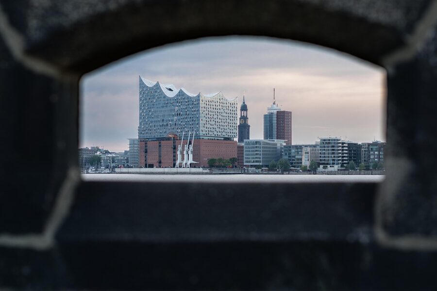 The Elbphilharmonie reflected in the Elbe at low tide