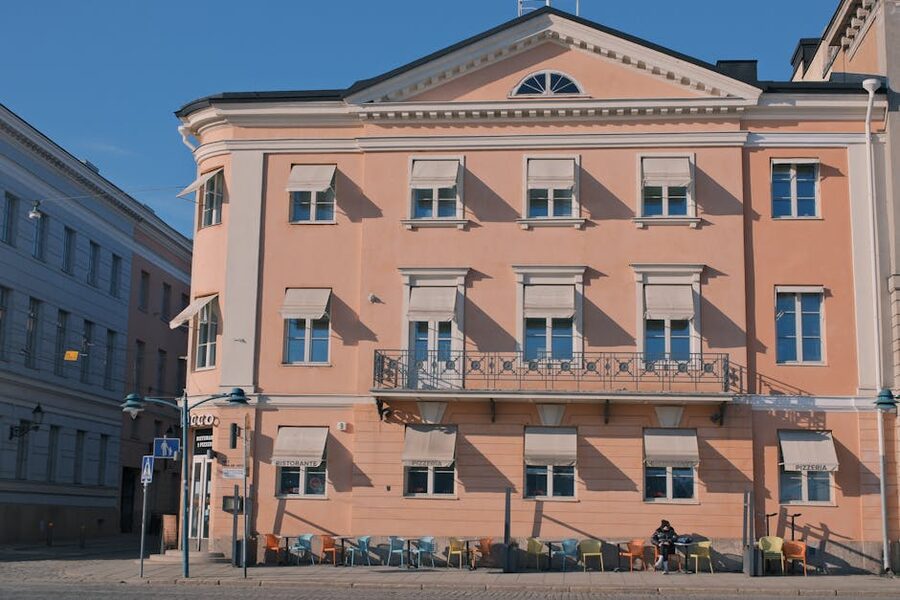 A pink-painted café front on a Helsinki street, the design-district end of town