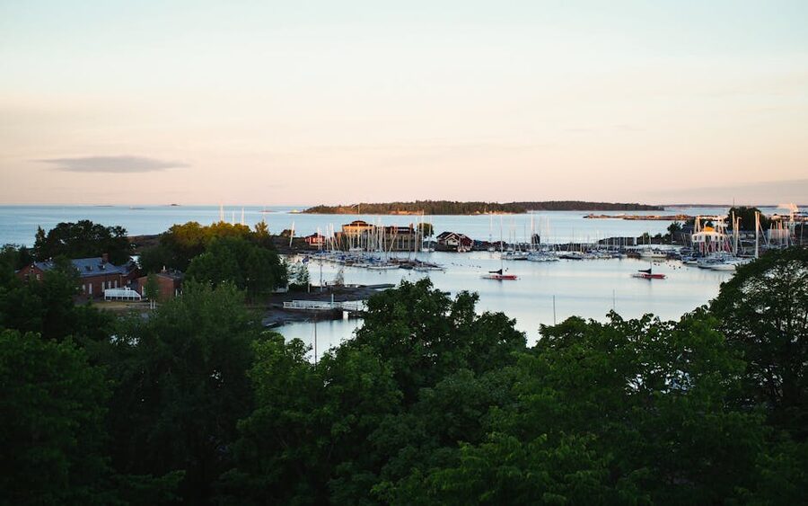 A view of Helsinki harbour at sunrise with boats