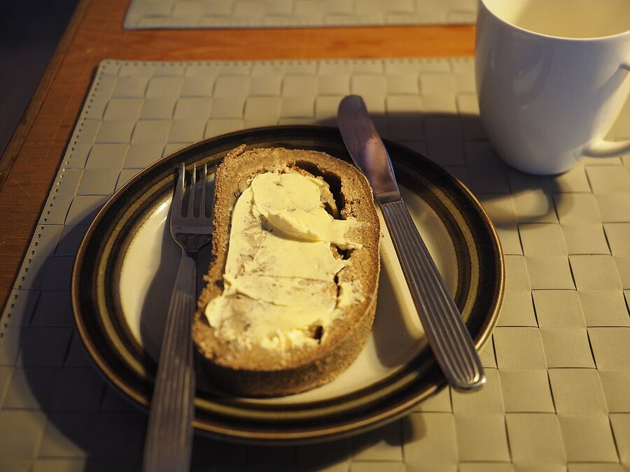 A sliced kalakukko showing the dense rye crust and the fish-and-pork filling inside