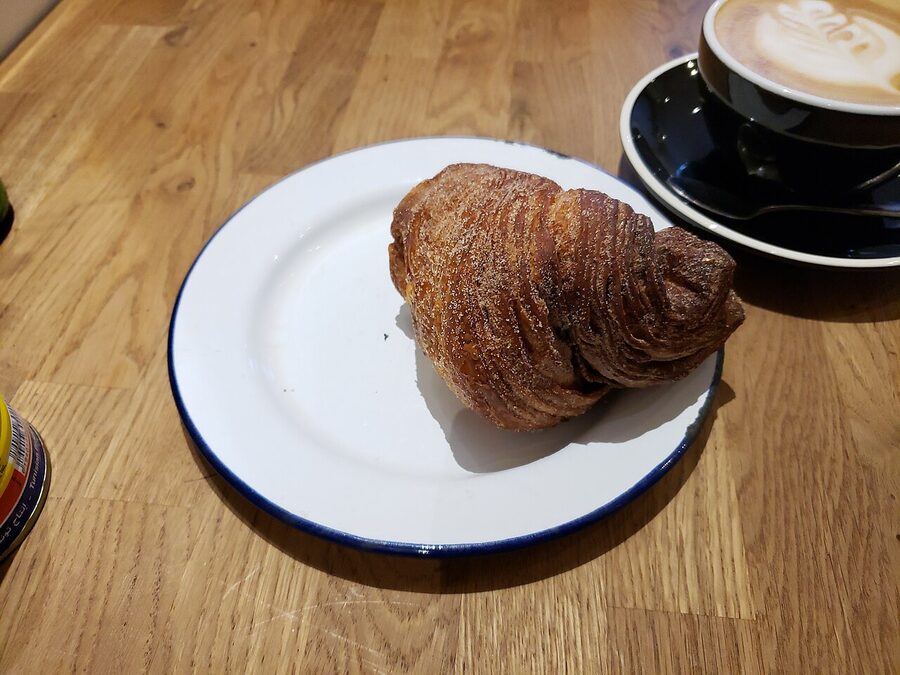 A korvapuusti served at a small Helsinki café with a cup of coffee