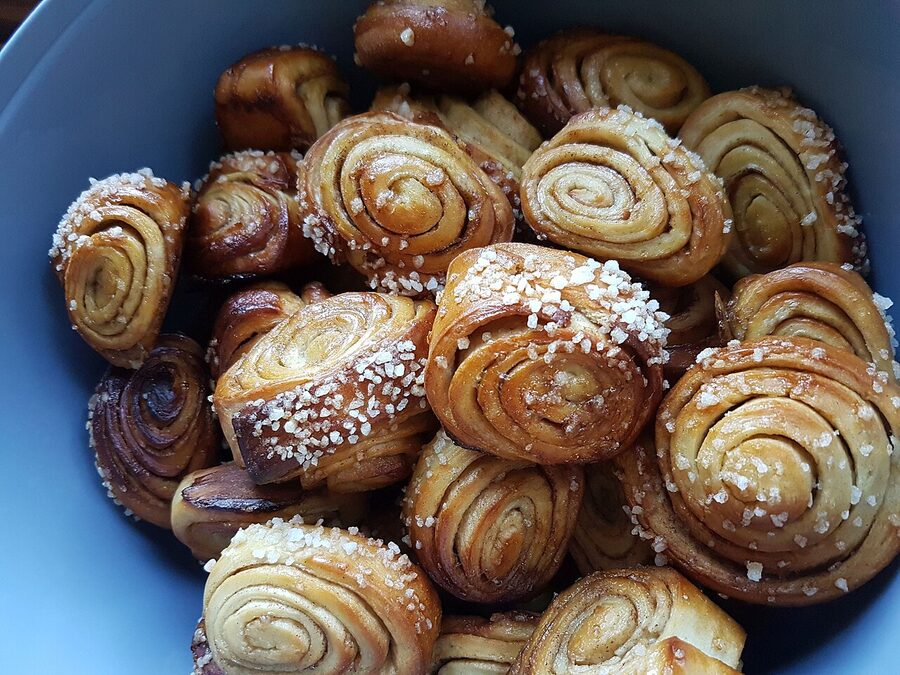 A homemade korvapuusti freshly out of the oven, the cardamom-and-cinnamon swirl visible
