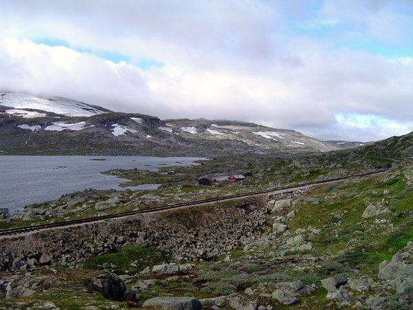 Bergen Line crossing the Hardangervidda plateau near Finse station
