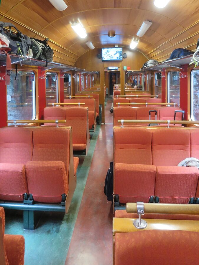 Inside a Flåm Railway carriage with old-style facing seats