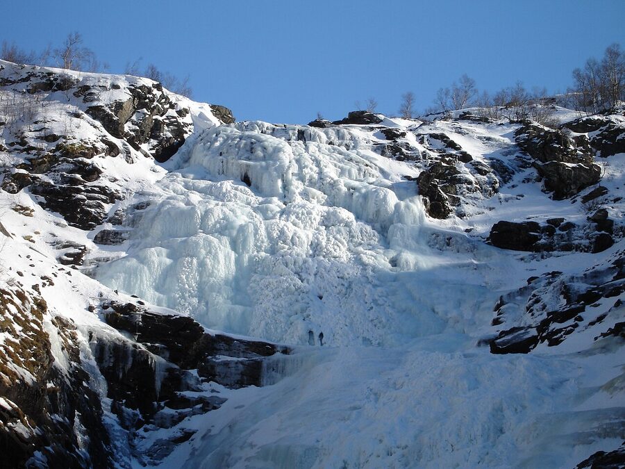 Kjosfossen waterfall frozen in winter ice