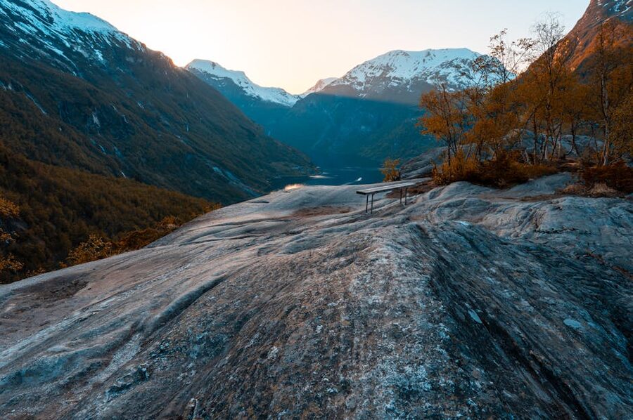 Autumn sunset over Geirangerfjord with snow-streaked peaks