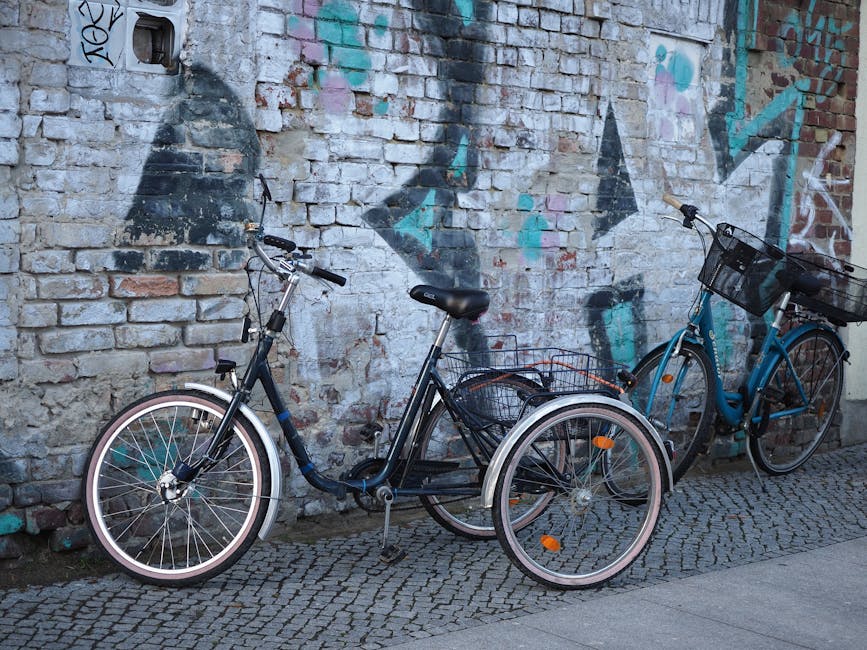 Bicycles parked against a brick wall