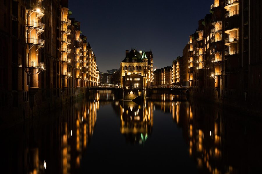 HafenCity at night with the illuminated Speicherstadt warehouses