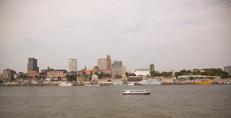 Hamburg skyline from the Elbe river with cranes and steeples