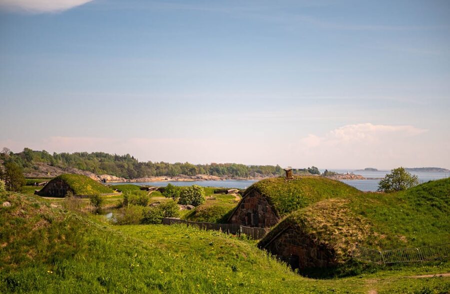 The Suomenlinna sea fortress in spring with green hills and stone walls