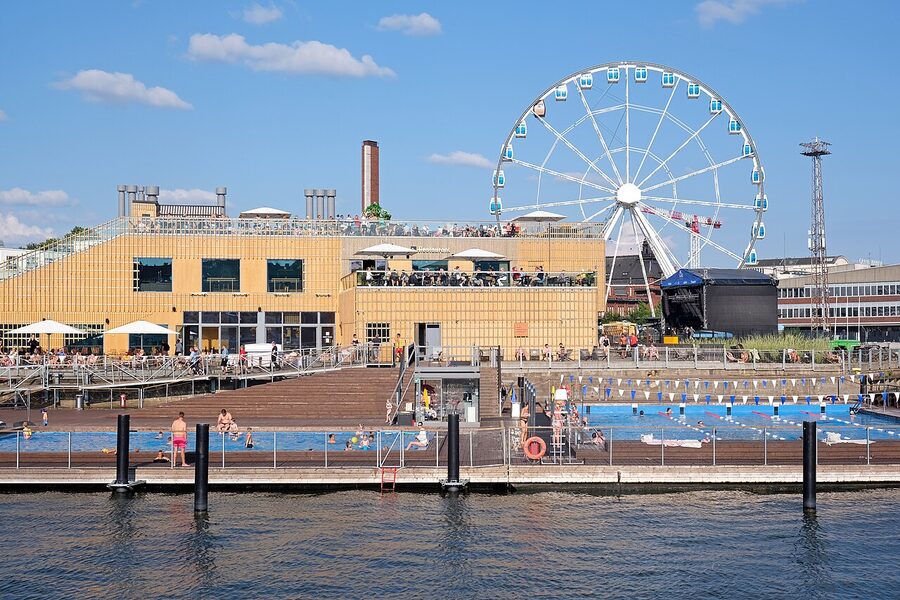 Allas Sea Pool seen from the harbour with ferries in background