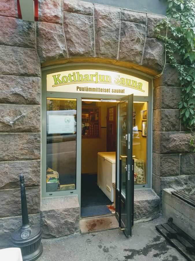 The exterior of Kotiharju public sauna in Kallio, Helsinki, on a corner street