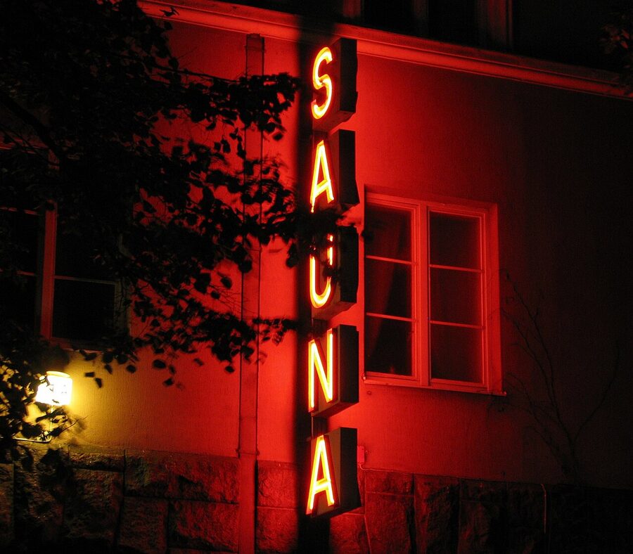 The neon SAUNA sign above the entrance to Kotiharjun Sauna in Kallio, Helsinki