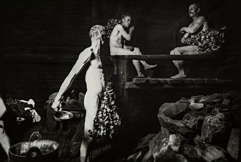 A black and white photograph of a Helsinki sauna interior in the early 1900s