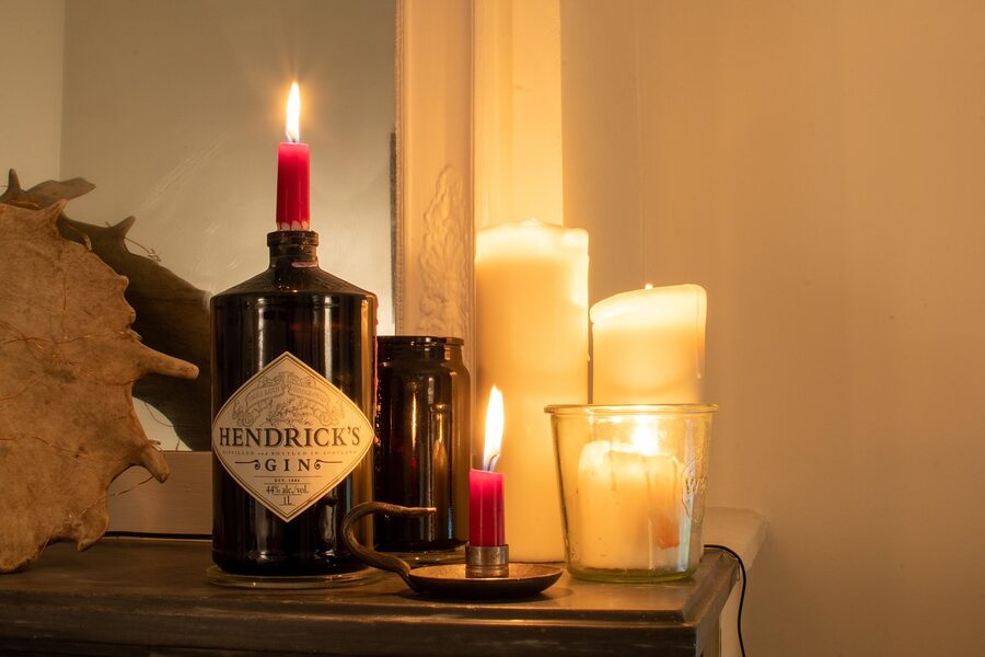 Beeswax candles burning on a wooden table