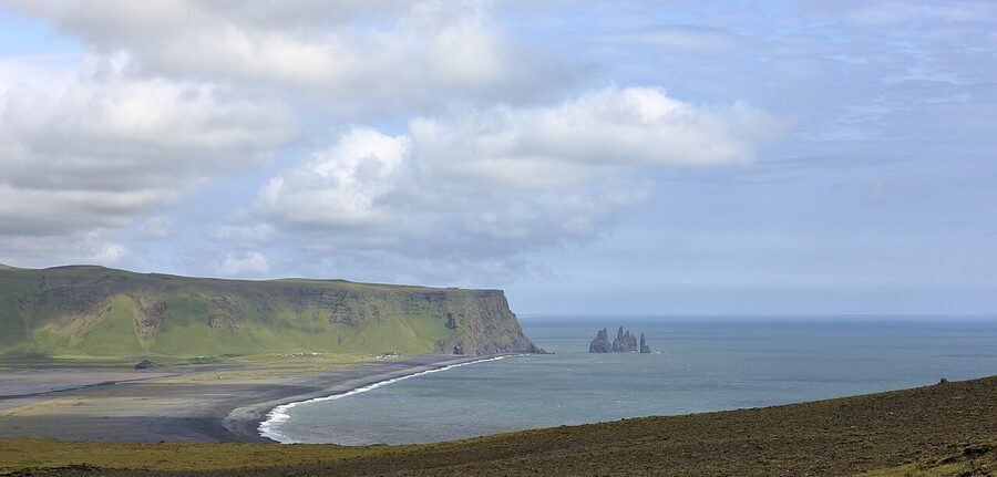 Reynisfjara black-sand beach with basalt columns and the offshore stacks