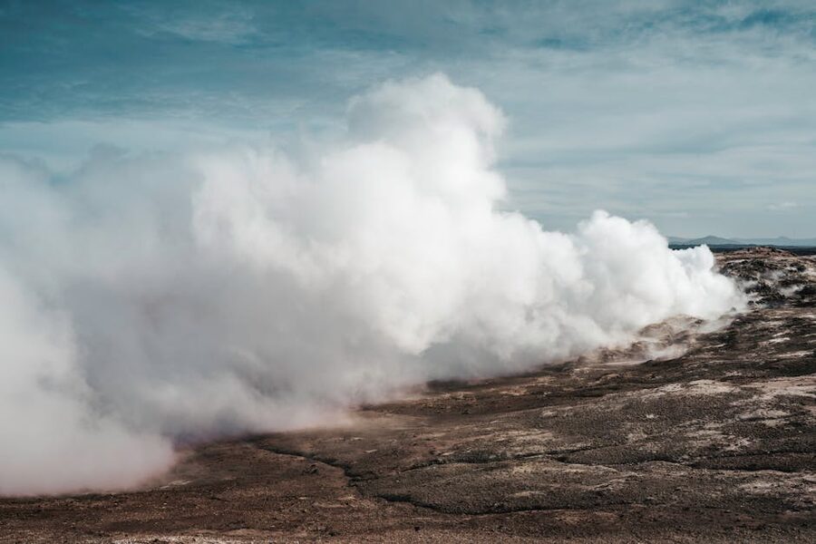 Geothermal steam rising from rocky ground in Iceland