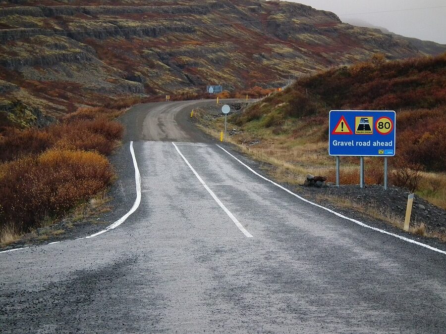 A gravel road ahead warning sign on Road 60 Iceland