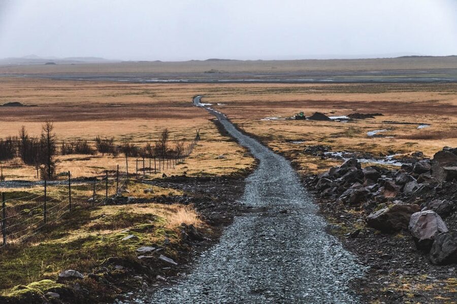 A winding gravel road through the Icelandic countryside