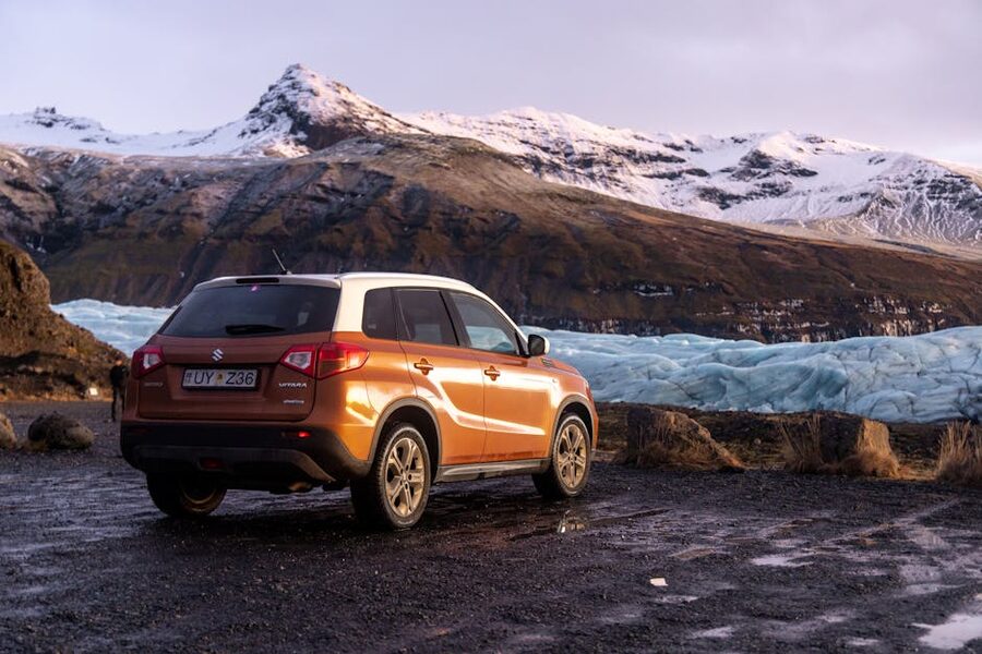 A rental SUV parked near an Iceland glacier