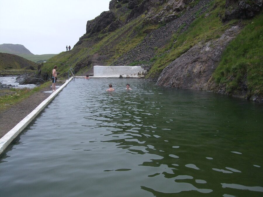 A close-up of the green algae-tinted water at Seljavallalaug