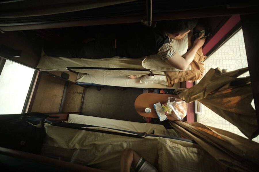 A made-up bunk in a sleeper compartment