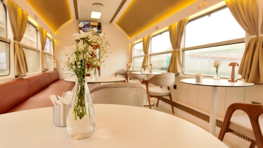 Interior of a vintage train dining car with patterned upholstery