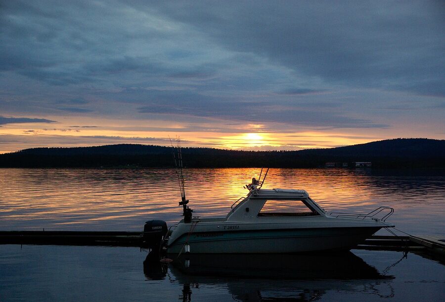 Fishing boat on a Finnish lake under the midnight sun
