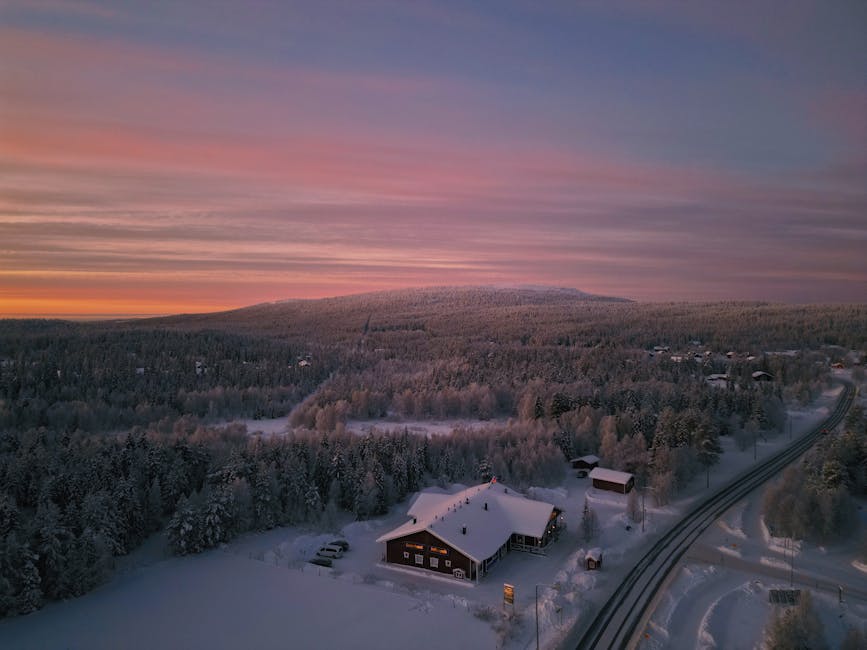 Snow-covered fells around the Levi and Yllas area at winter sunset