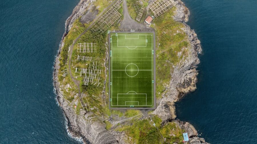 Henningsvær soccer pitch and harbour from above