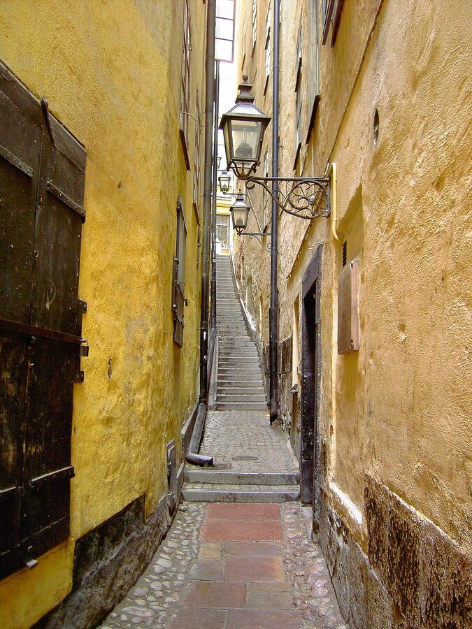 Mårten Trotzigs Gränd, the narrowest alley in Stockholm Gamla Stan, with stone steps and old buildings on either side